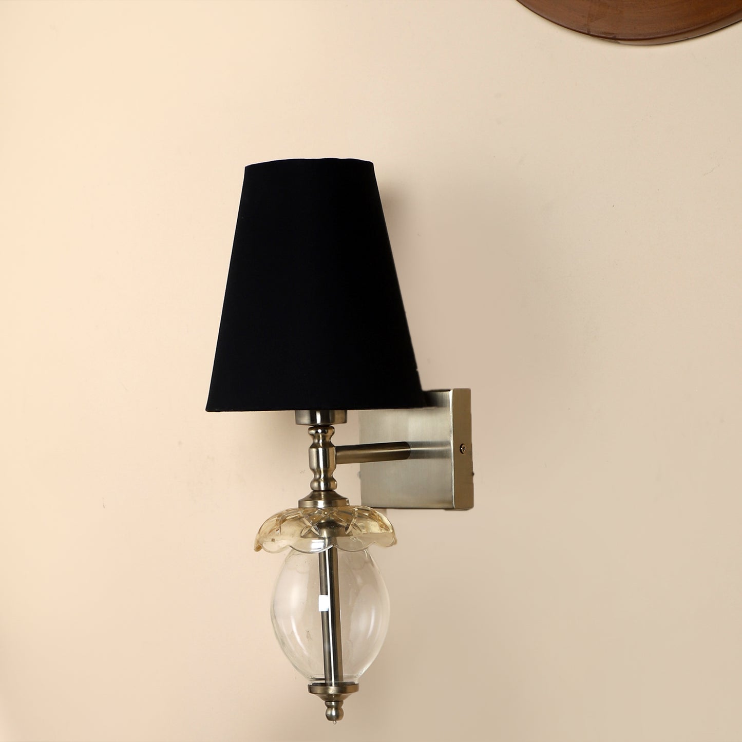 Square base single Wall Light with oval glass shape